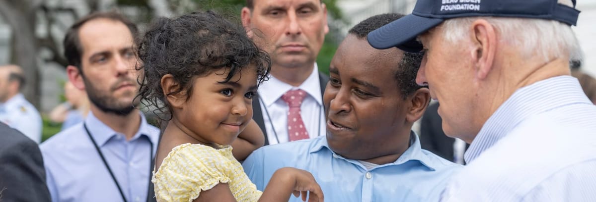 Joe Neguse and his daughter at a White House event, July 12, 2022. Neguse was the first Black member of the Colorado delegation.