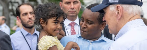 Joe Neguse and his daughter at a White House event, July 12, 2022. Neguse was the first Black member of the Colorado delegation.